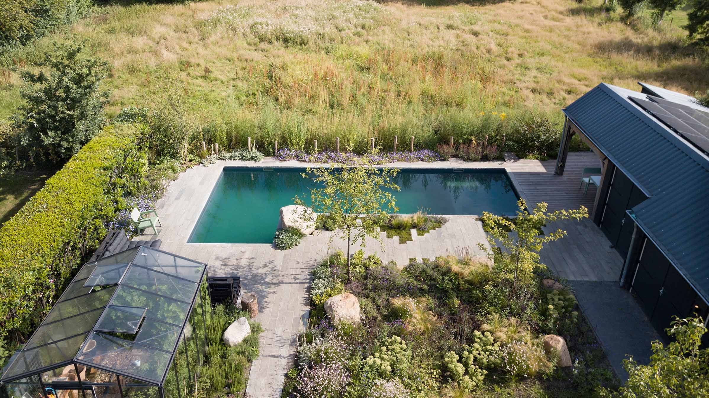 Natural pool and garden united and built exclusively with natural materials